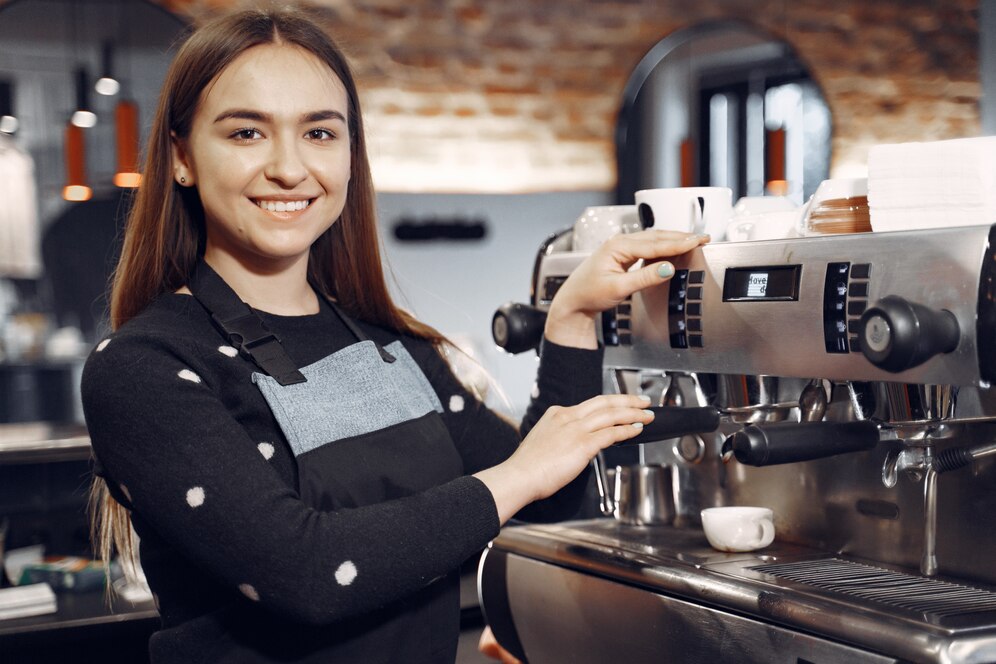 young barista girl makes coffee smiles 1157 36650